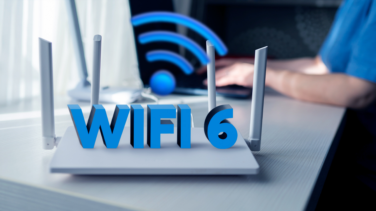 Roteador moderno emitindo o sinal tecnológico de Wi-Fi 6 para uma smart TV e notebooks conectados à internet banda larga em Vinhedo da ViaFibra.